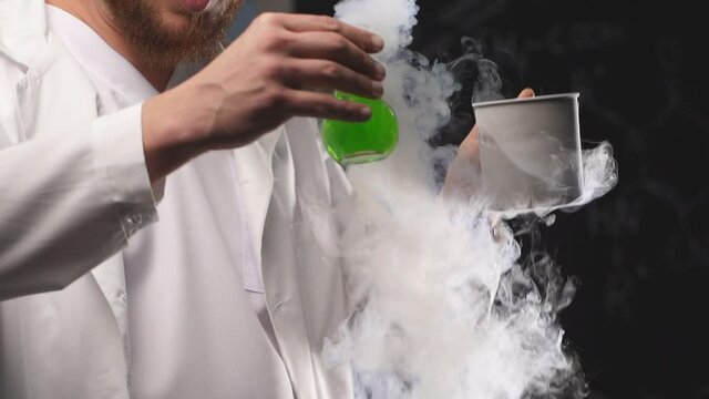 The chemist shows a show using liquid nitrogen. Slow motion.