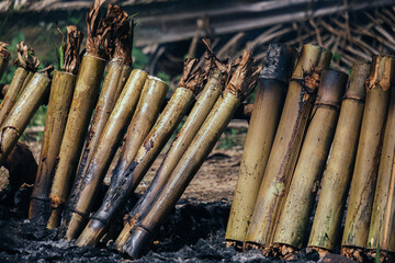 Cooking rice in a bamboo cylinder