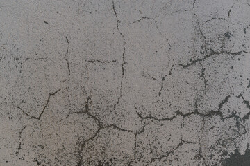 Concrete surface with weathered backdrop paint. Crack effect. Color - Venus, Hue Violet.