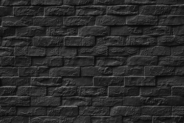 Surface of Vintage black brick wall background.