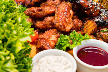 Barbecue chicken with vegetables on wooden table