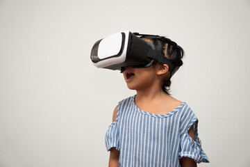 Little Asian girl child with virtual reality headset is exciting for new experiencing. Concept of 3D gadget technology and virtual world gadgets game and online education in the future