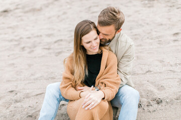 Engagement proposal at beach in Playa Del Rey, California Young Couple