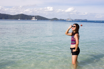 Young woman enjoy posting on beach.