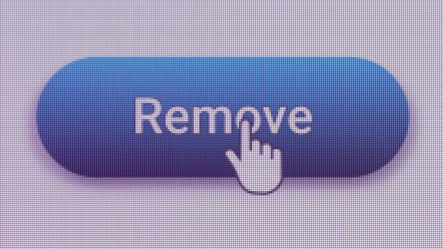 Remove Button Click Extreme Close Up Front View 
A command button on a computer screen which delete files completely or erases text.
