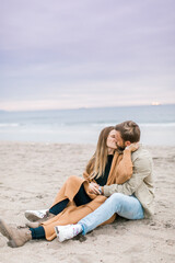 Fototapeta premium Engagement proposal at beach in Playa Del Rey, California Young Couple