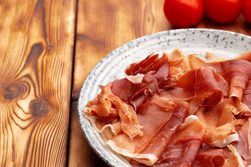Delicious meat slicing on plate close up