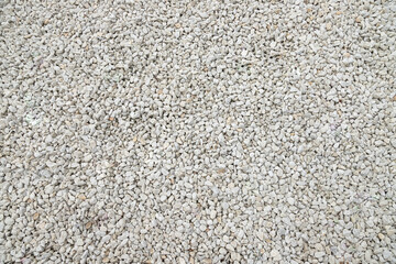 Background, texture of white crushed stone. Use for decorating garden plantings.