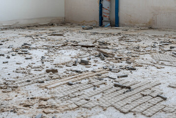 concrete wall and floor, construction or destruction site with remnants of tile adhesive