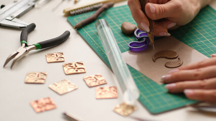 Craft jewelery making with professional tools. A handmade jeweler process, manufacture of jewellery.