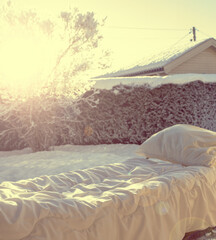 Airing out bedsheets and pillow on a sunny cold winters day.
