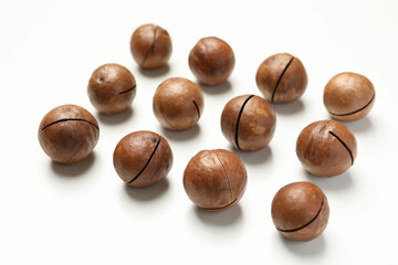 Flat lay with tasty macadamia nuts on white background