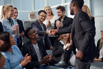 Image employers in office shaking hands after successful negotia - obrazy, fototapety, plakaty