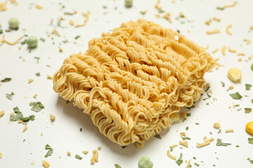 Instant noodles and spices on white background