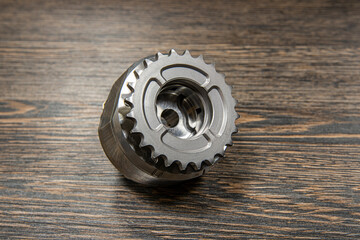 Internal combustion engine VVTI clutch on wooden background
