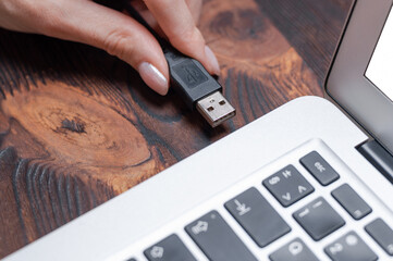 Image of a usb cable plugged into a laptop port. The concept of modern ultra-fast ways of...