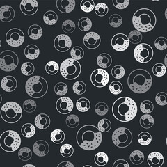 Grey Donut with sweet glaze icon isolated seamless pattern on black background. Vector.