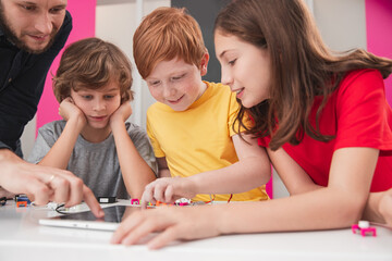 Pupils with teacher learning computer programming