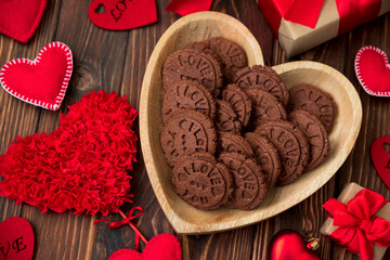 Valentines day greeting card with chocolate cookies, gift box and felt hearts. I love you sign. Top view. Flat