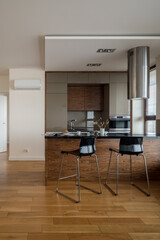 Kitchen with kitchen island with chairs