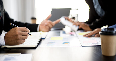 The atmosphere in the startup's meeting room was attended by three delegates to brainstorm and plan the company's operations. Young businessmen form startups and are growing higher. Startup idea.
