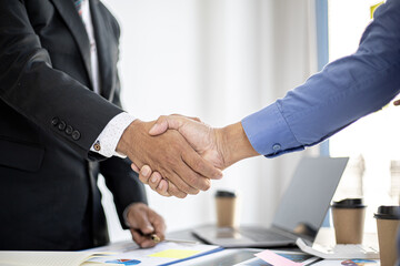 Businessmen Handshaking join to form a startup, Handshaking is a Western greeting or congratulation. Young businessmen form startups and are growing higher. Startup idea.