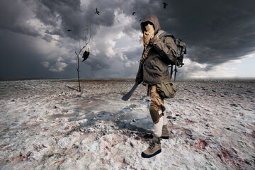 Post apocalyptic warrior standing in the salt desert. - 412466836