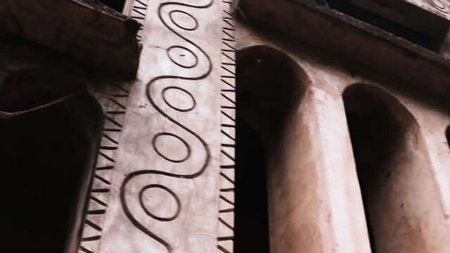 Different types of art and drawing made on the wall. the front part is in focus and the background is blurred