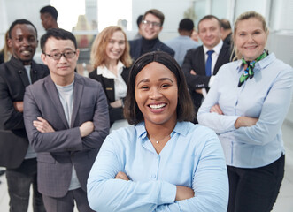 group of leading experts standing in the office lobby .