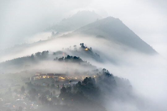 Village at the foot of Mount Bromo in the mist, East Java, Indonesia