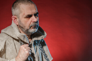 A wandering militant monk practicing a martial art with a chain in his hands