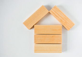 House of wooden blocks on a white background