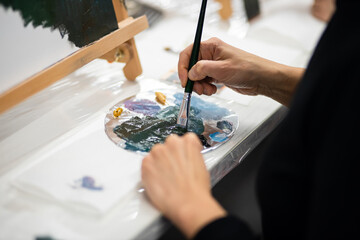 The artist draws a close-up picture