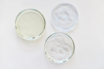  glass Petri dishes witn agar substrat on a laboratory table. sterile lab dishes ready for tests. analysis and chemical experiment. cell culture growing equipment. top view