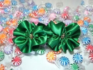 Green ribbon with vivid candy background.  