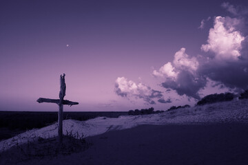 Purple landscape with wooden Cross or crucifix.  Concept for Lent Season, Holy Week, Palm Sunday...