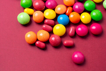 colorful little candies on a colored background