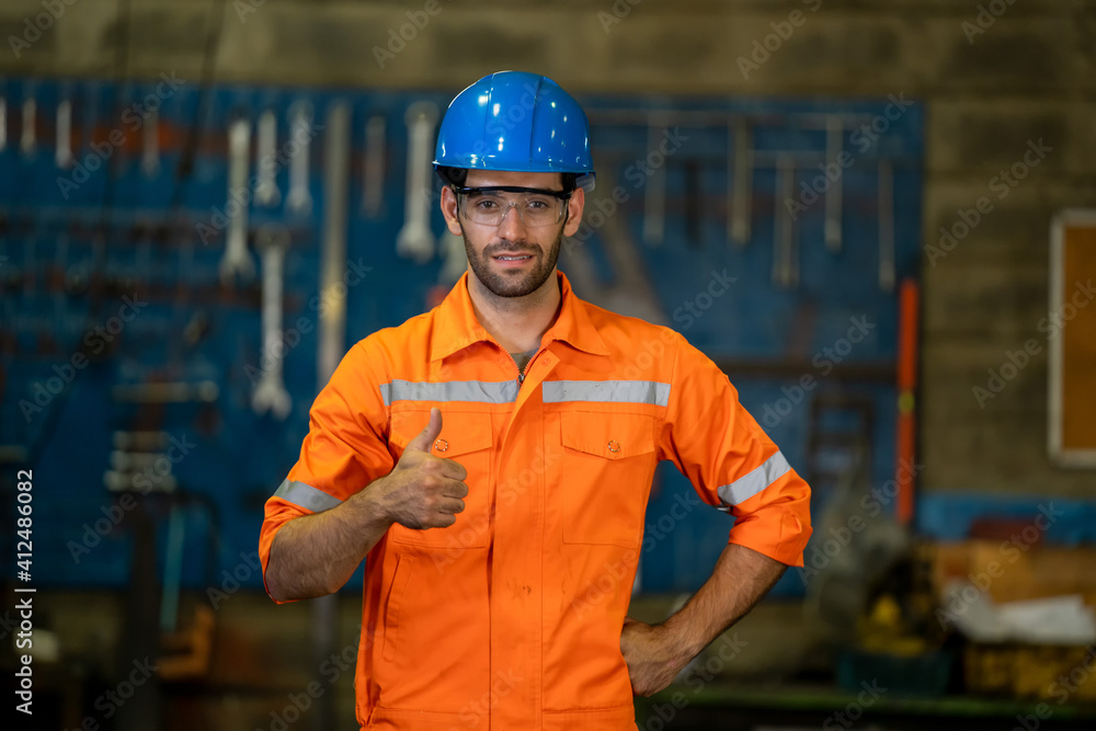 Aufkleber Portrait engineer showing thumb up in factory.