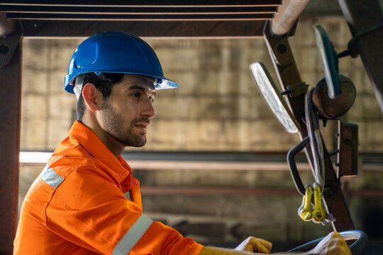 Factory Worker Are Working On A Forklift In Factory.