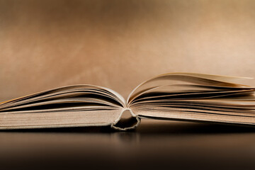 An open book lying on the table.