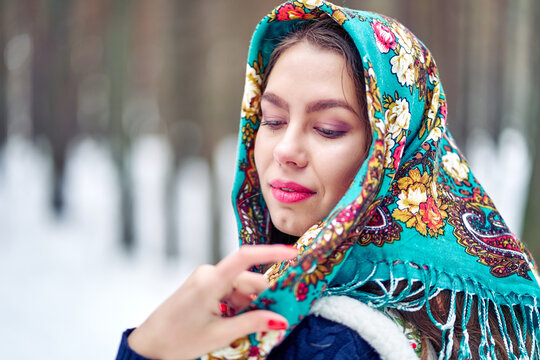 A woman in a Russian headscarf. National headdress.