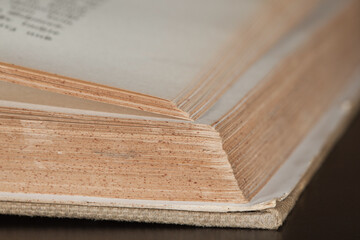  Fragment of an open book lying on the table.
