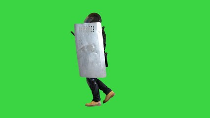 Riot policeman running with a shield and baton on a Green Screen, Chroma Key.