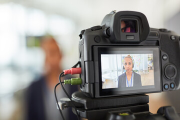 Business woman in front of a video camera