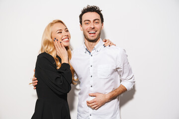 Beautiful smiling young smartly dressed couple