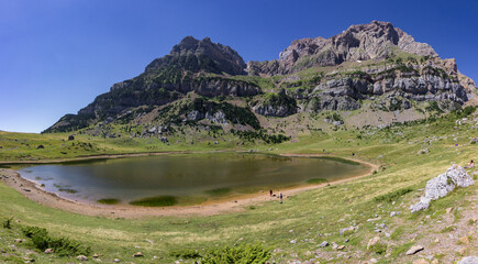 Fototapeta na wymiar View of lake Piedrafita and surrounding area in the Pyrenees (Spain)