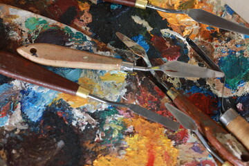 brushes, paints and palette, all for creativity