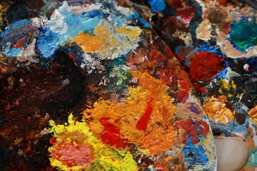 brushes, paints and palette, all for creativity