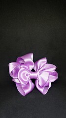 Fancy purple ribbon bow photo for commercial use. 