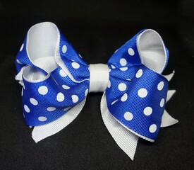 Fancy blue and white ribbon bow photo for commercial use. 